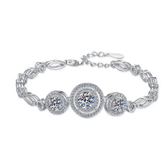 Sterling silver bracelet with three large round moissanite stones and smaller accent stones