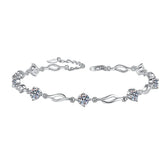 Silver bracelet with diamond-like stones on a white background