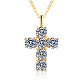 Gold cross pendant necklace with clear gemstones on a white background