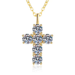 Gold cross pendant necklace with clear gemstones on a white background