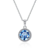 Silver necklace with a blue gemstone pendant on a white background