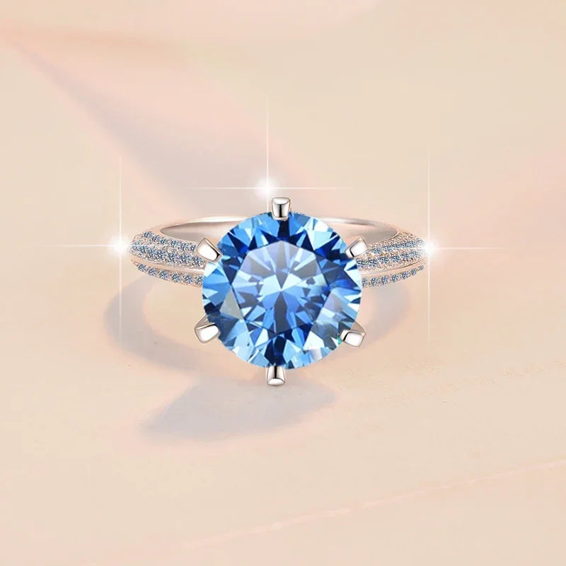 Ring with a blue gemstone on a beige background