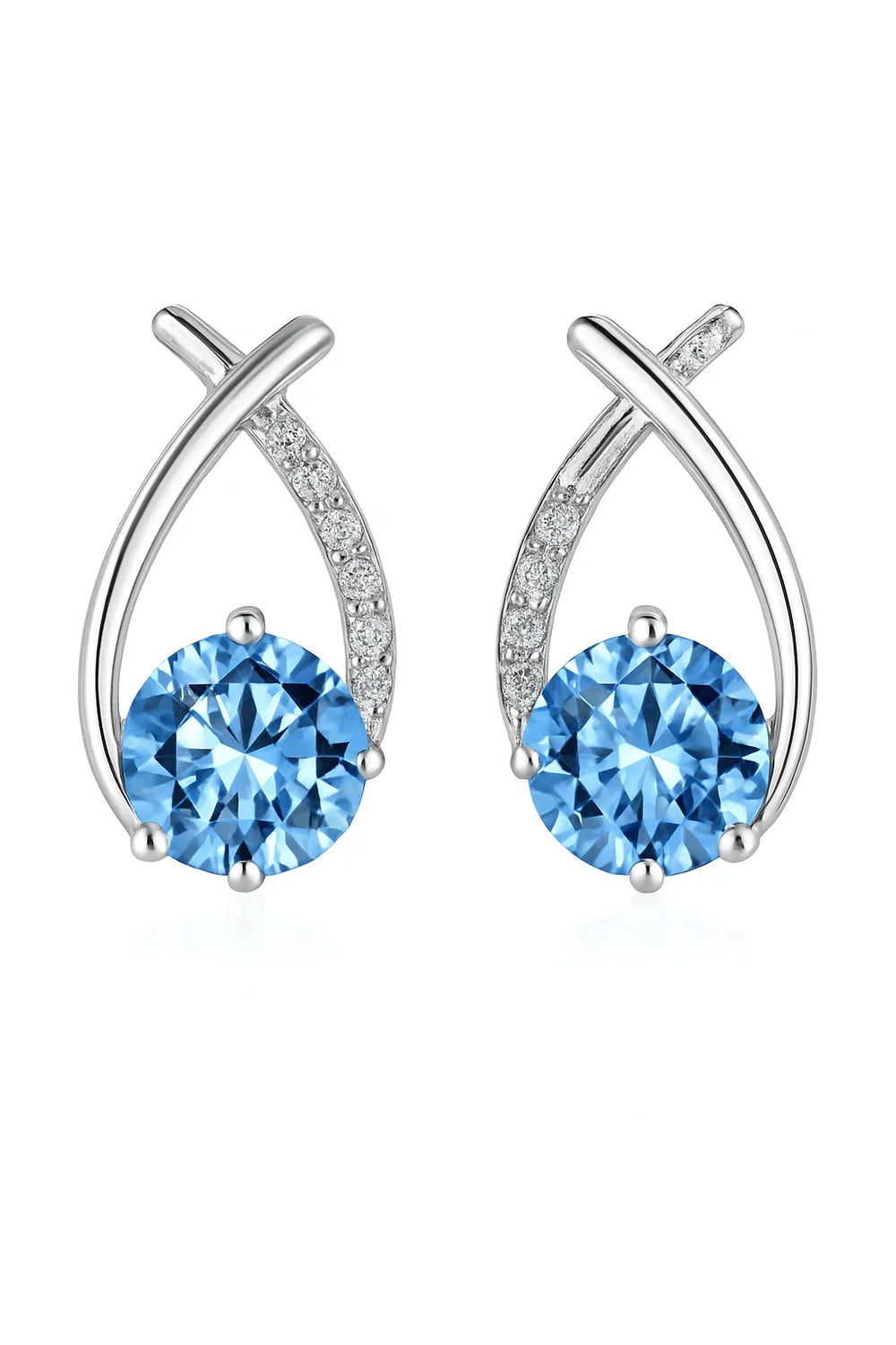 Pair of silver earrings with blue gemstones on a white background