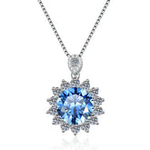 Silver necklace with a blue gemstone pendant on a white background