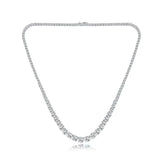 Silver necklace with clear stones on a white background