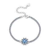 Silver bracelet with a blue gemstone on a white background