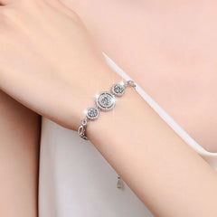 Moissanite bracelet with sparkling round stones on wrist in soft natural lighting