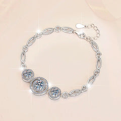 Elegant moissanite dangle bracelet with prong setting and sparkling round stones on silver chain
