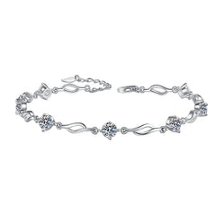 Silver bracelet with diamond-like stones on a white background