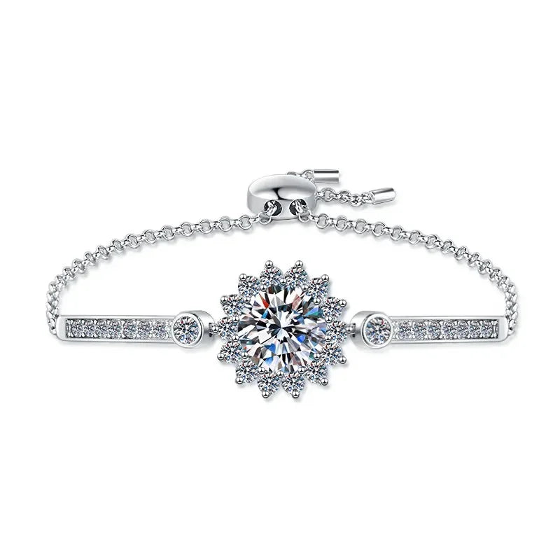Silver bracelet with a floral clasp on a white background