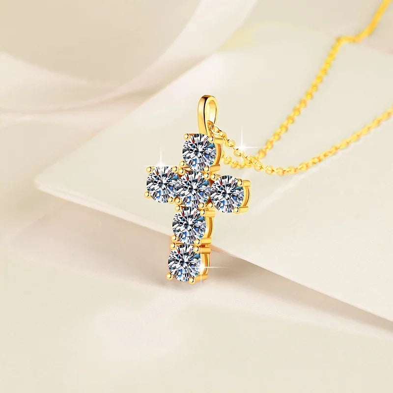 Gold cross pendant necklace on a beige background