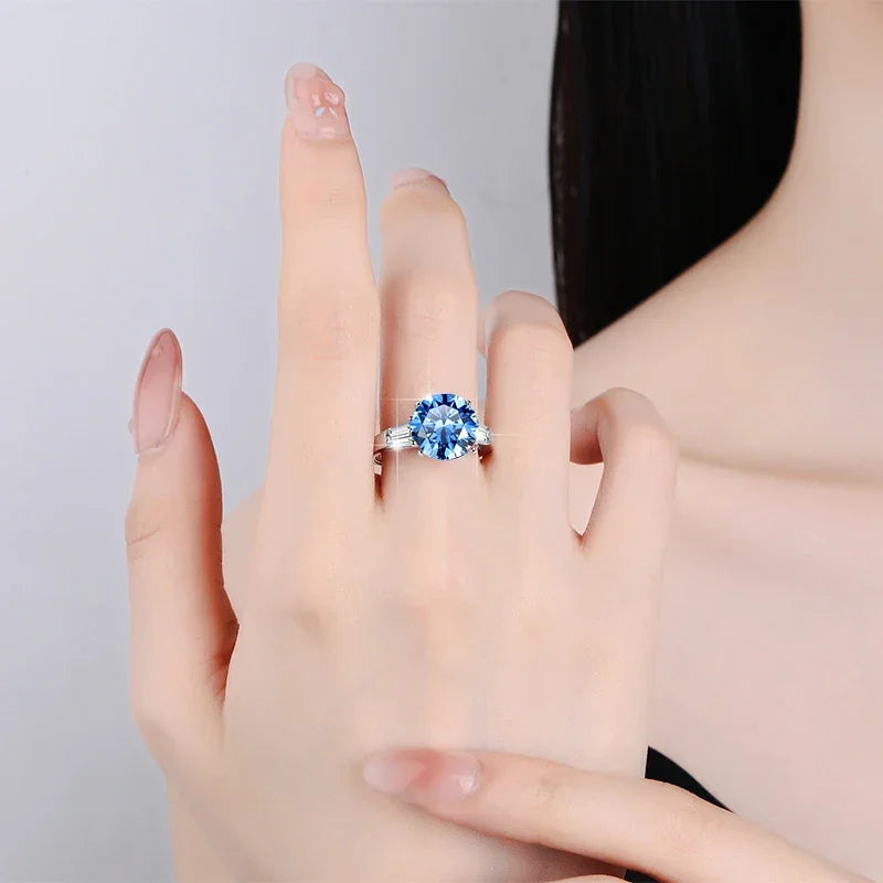 Blue moissanite engagement ring on hand, everyday wear look