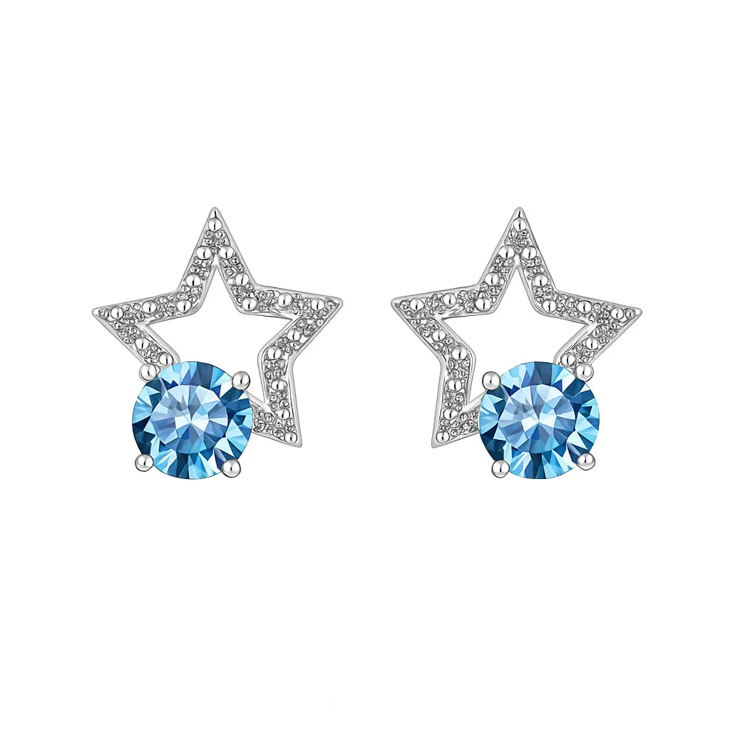 Star-shaped earrings with blue gemstones on a white background