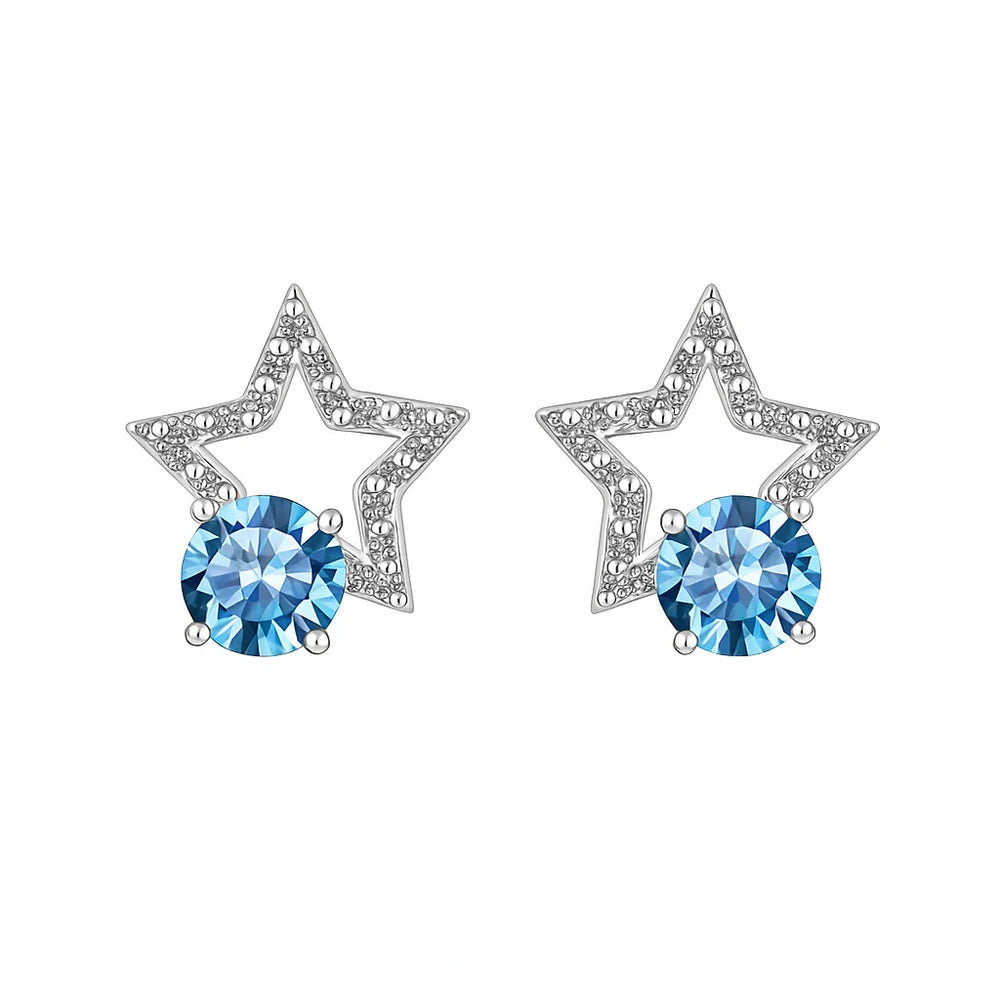 Star-shaped earrings with blue gemstones on a white background