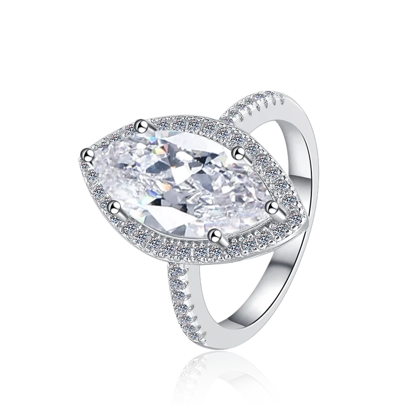 Silver ring with a large clear gemstone on a white background