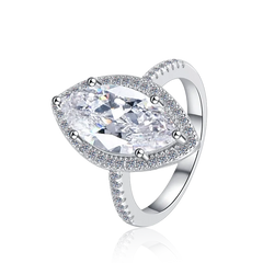 Silver ring with a large clear gemstone on a white background