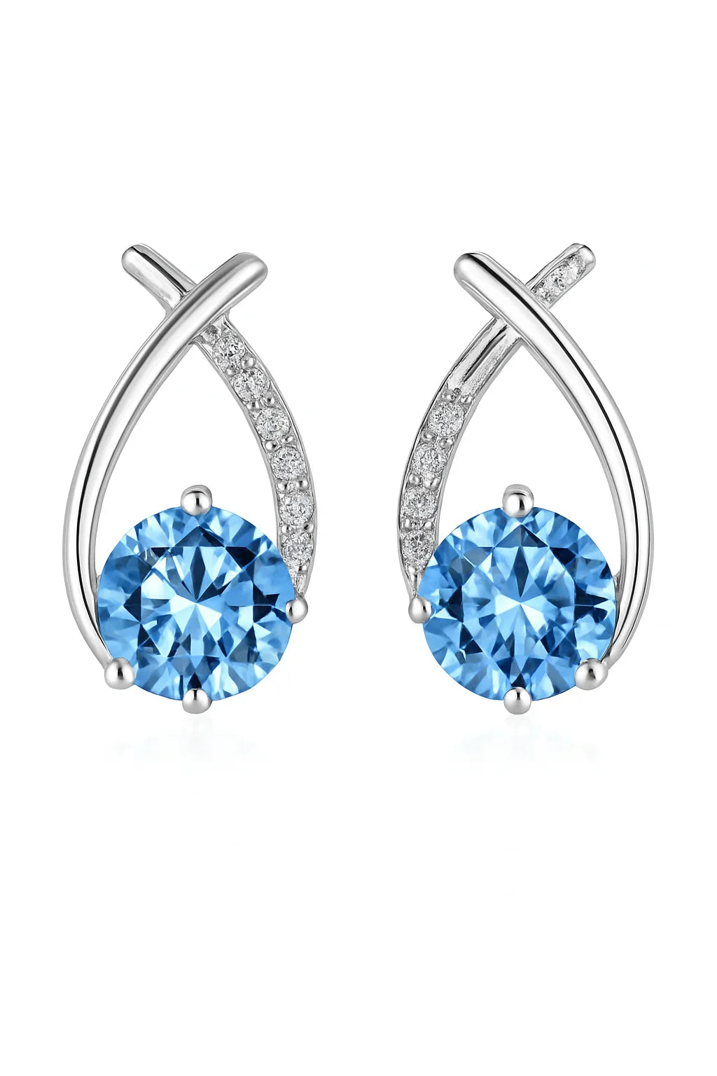 Pair of silver earrings with blue gemstones on a white background