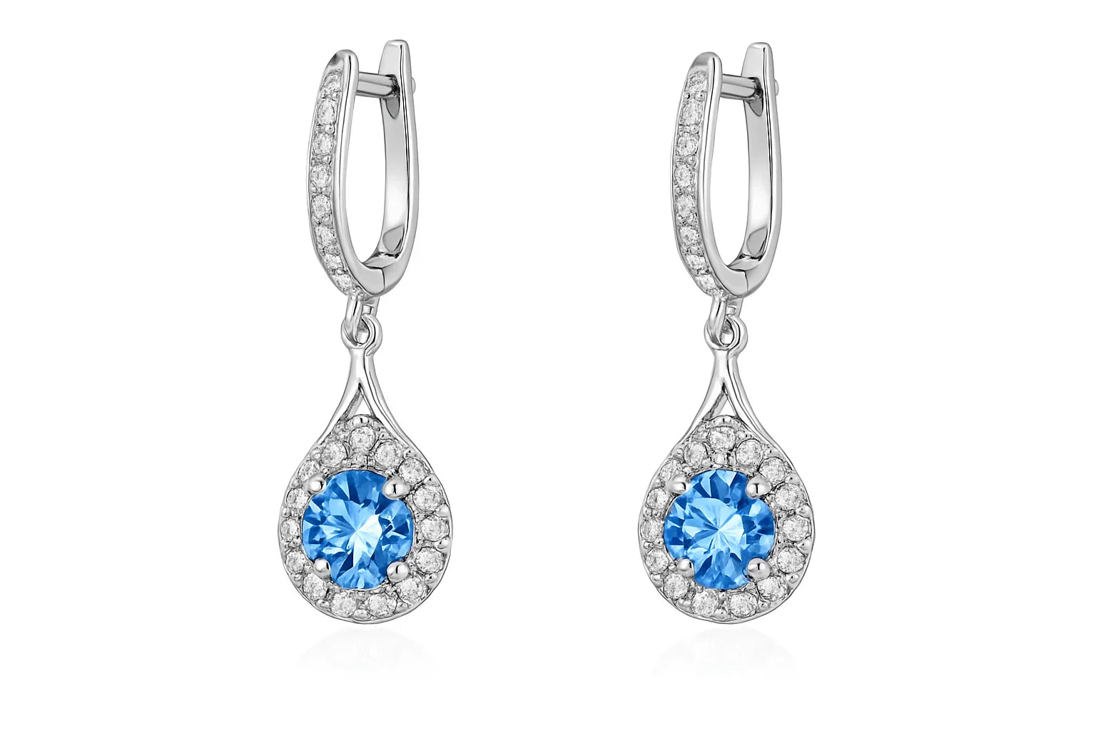 Pair of silver earrings with blue gemstones on a white background