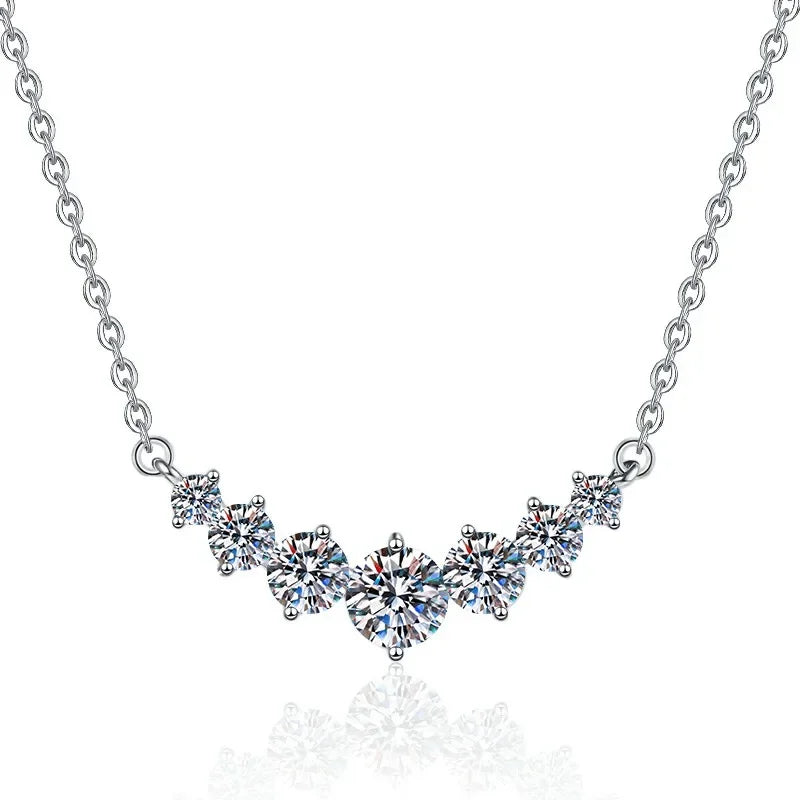 Silver necklace with diamond-like stones on a white background