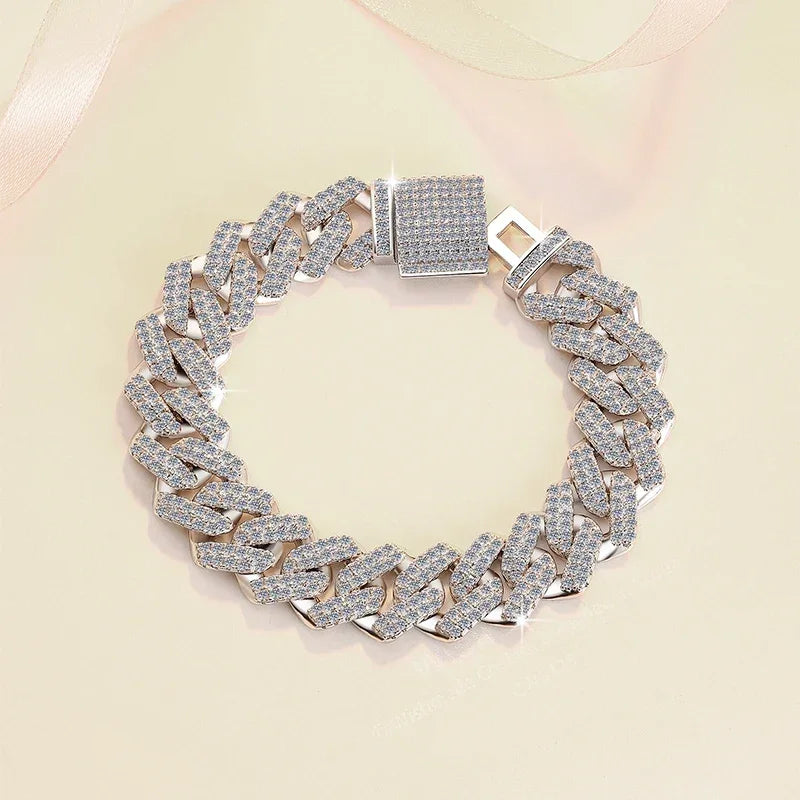 Silver chain bracelet with diamond-like stones on a light pink background