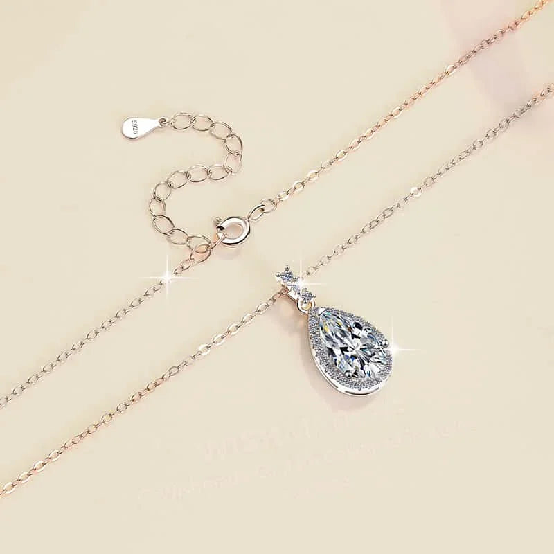 Necklace with a teardrop-shaped pendant on a beige background