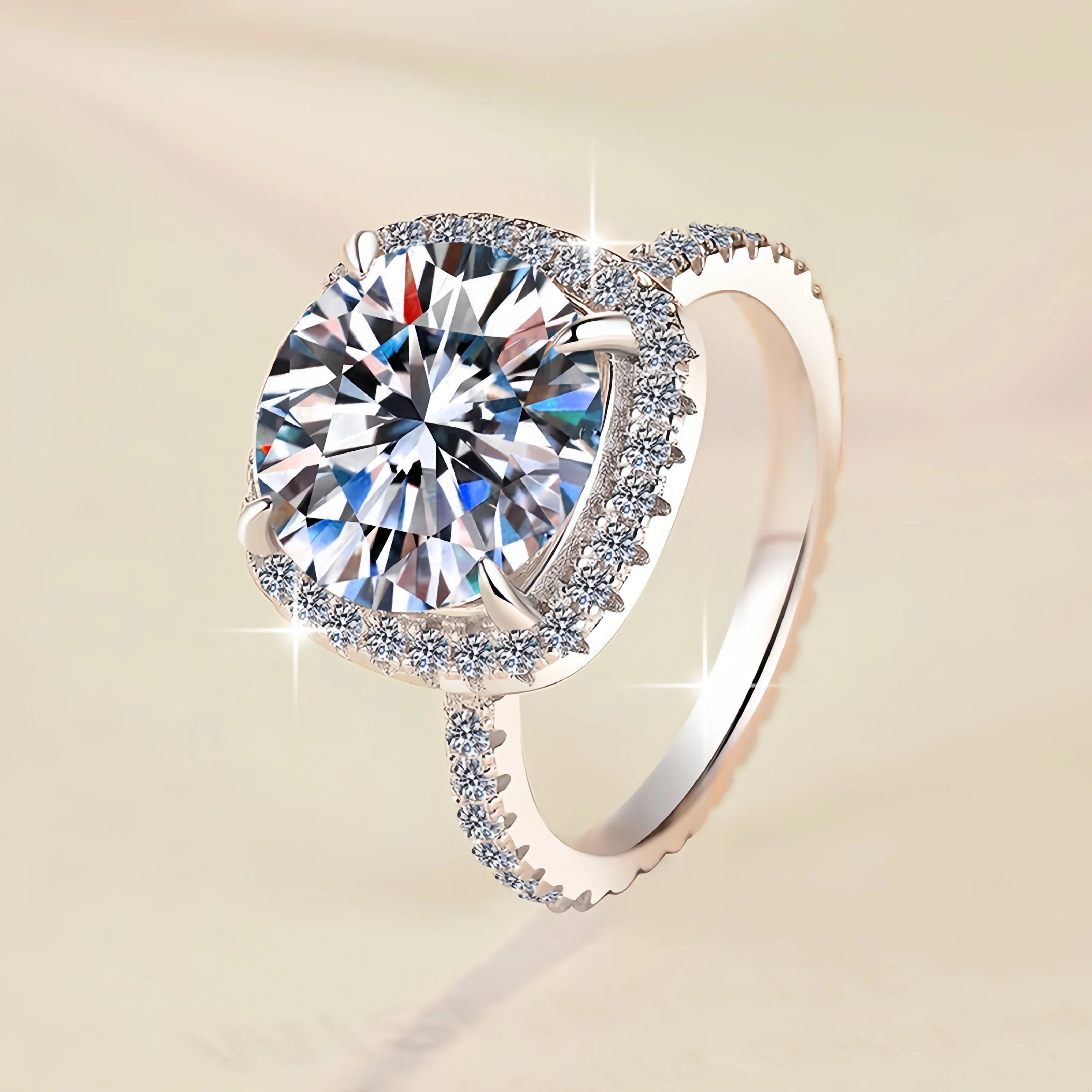 Silver ring with a large diamond on a beige background