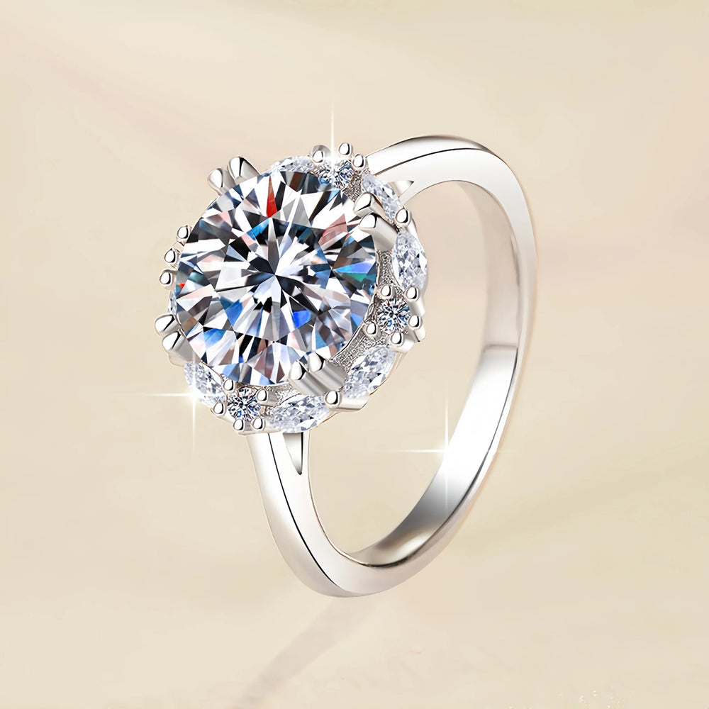 Silver ring with a large diamond on a beige background