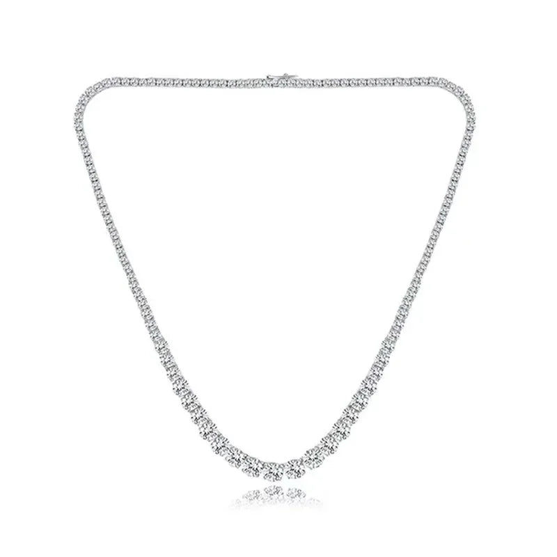 Silver necklace with clear stones on a white background