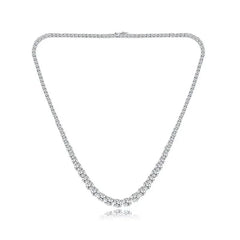 Silver necklace with clear stones on a white background