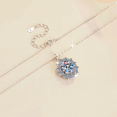 Silver necklace with a diamond pendant on a beige background