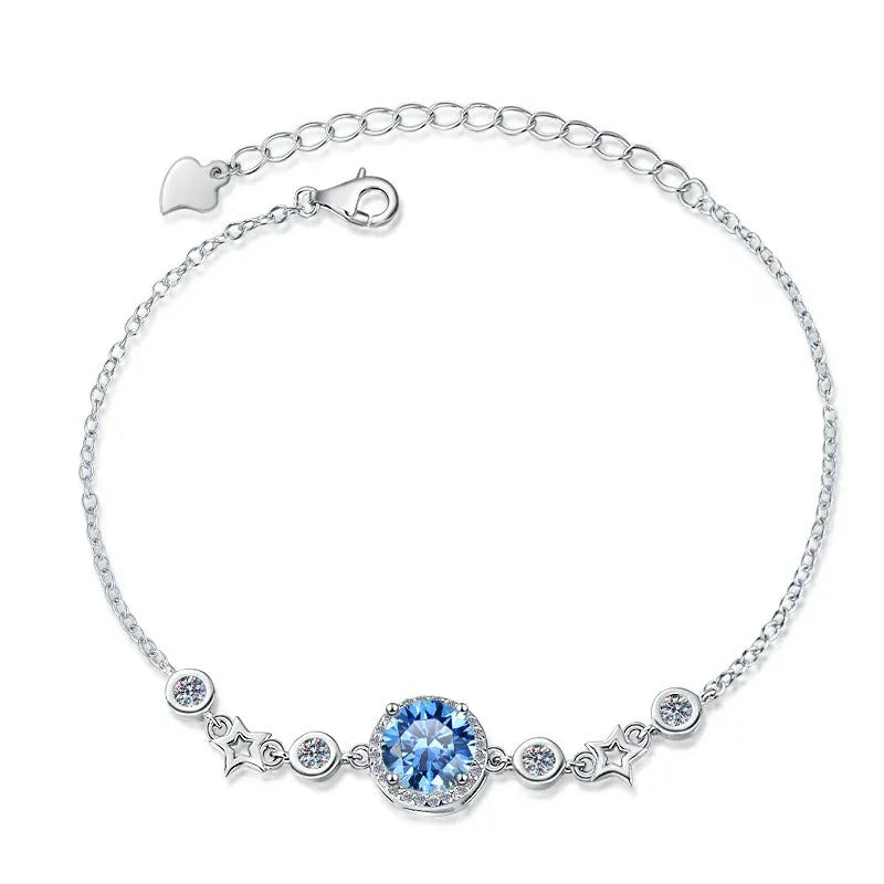 Silver bracelet with a blue gemstone on a white background