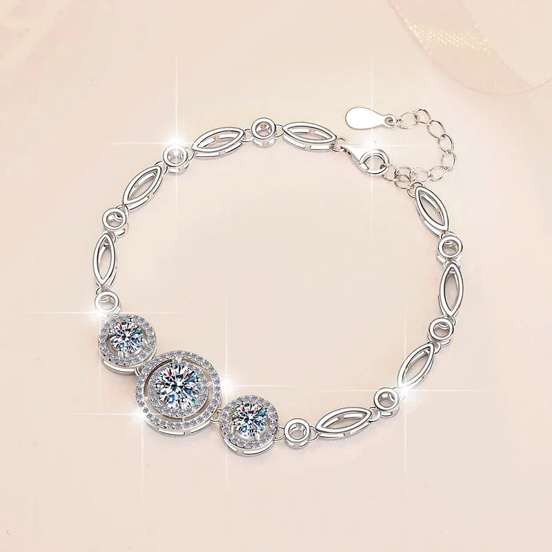 Elegant moissanite dangle bracelet with prong setting and sparkling round stones on silver chain