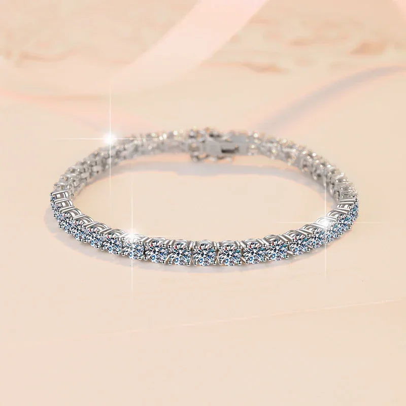 Silver bracelet with clear stones on a beige background