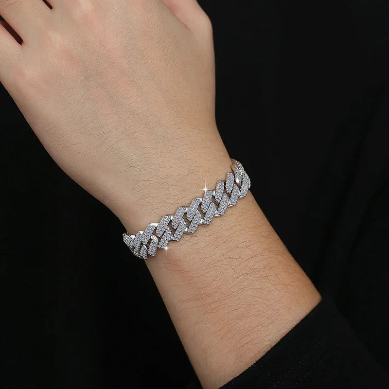Silver bracelet on a wrist against a black background
